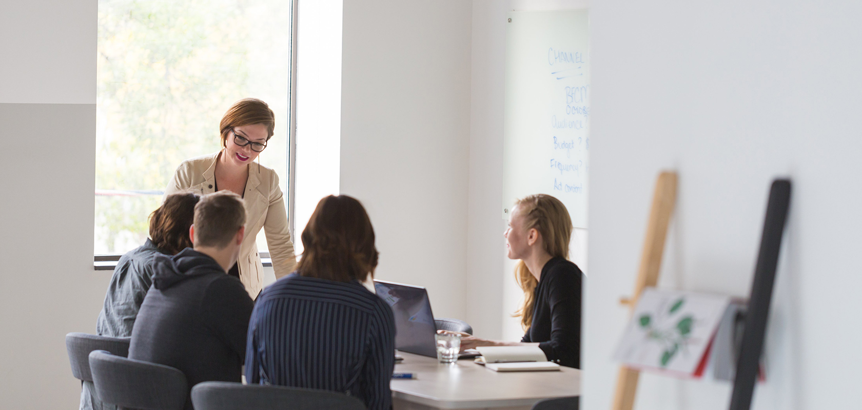 people in a conference room having a meeting