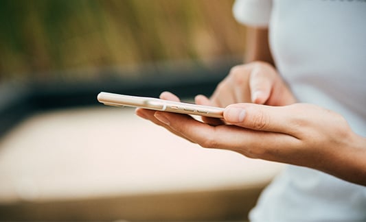 Woman holding an iphone