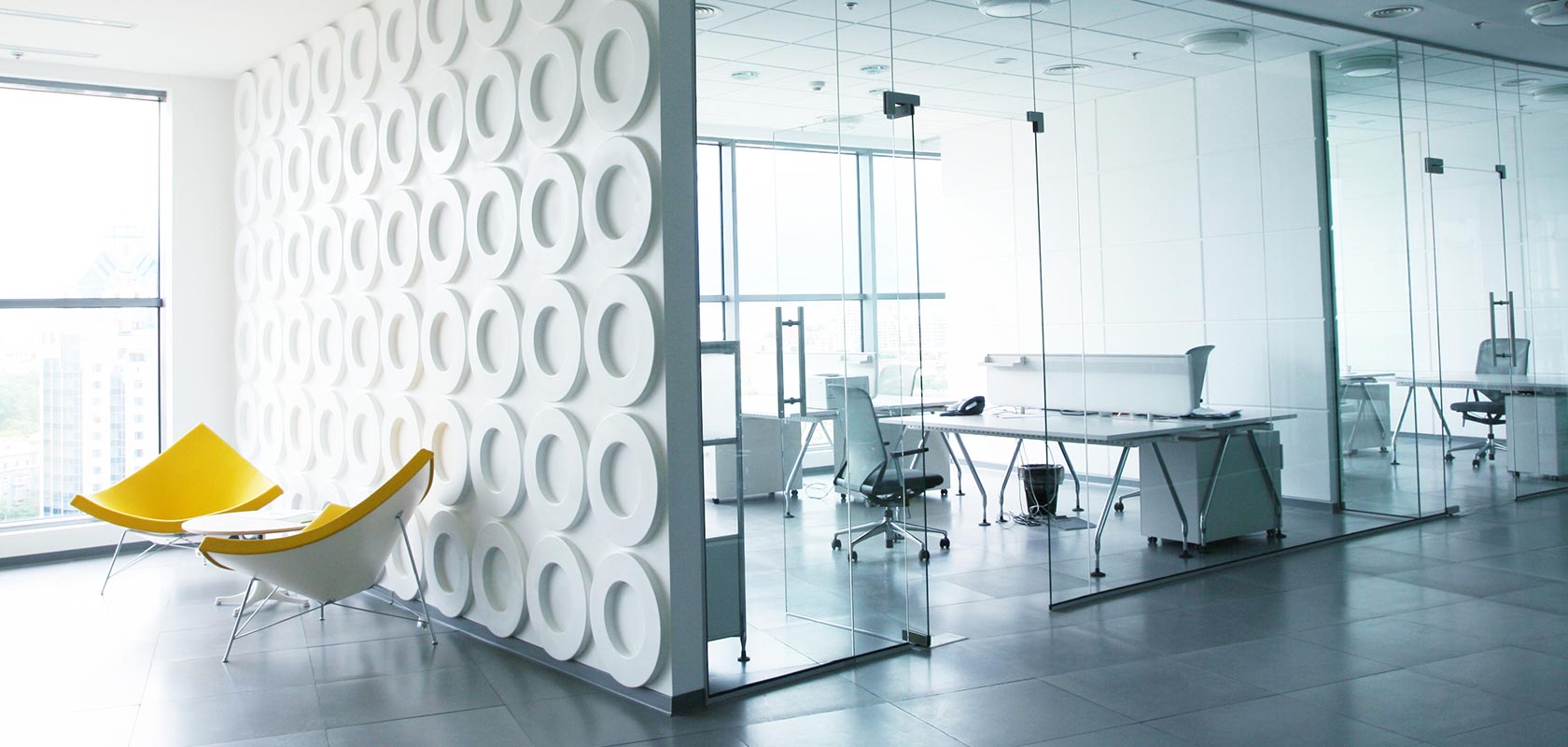 Bright office space with yellow chairs