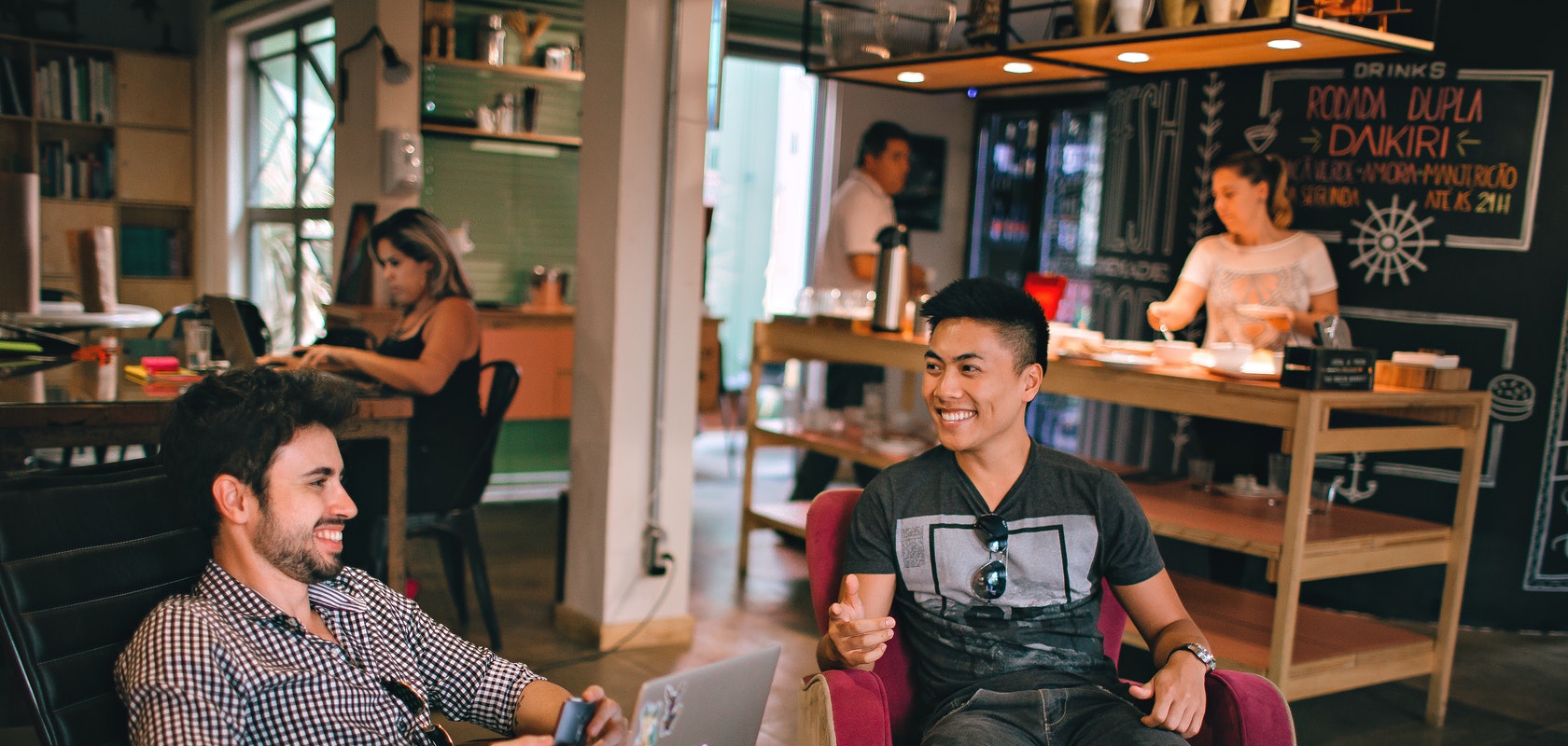 photograph-of-men-having-conversation-seating-on-chair-1015568