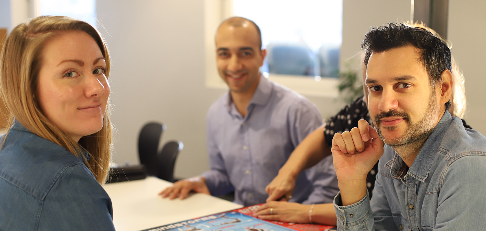 smiling colleagues in an office